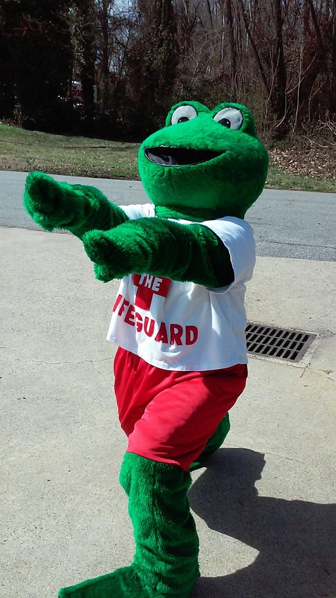 Image depicting a lifesize frog costume wearing a white t-shirt that says lifeguard in red letters.