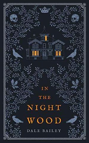 book cover, background navy blue with house, vines, skulls in light blue. Reads In The Night Wood by Dale Bailey in orange.